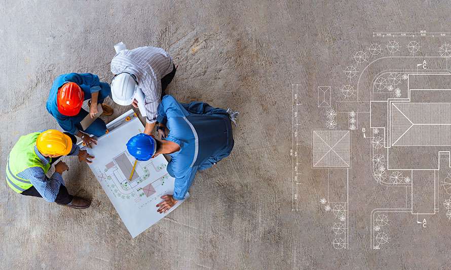 Architectural team working on blueprints